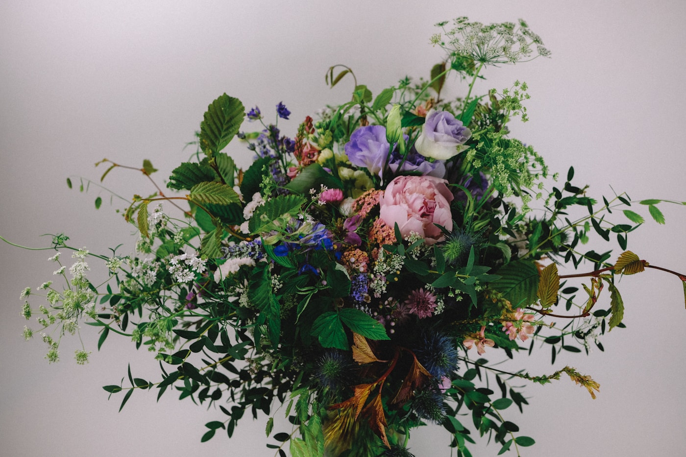 A painterly bouquet prepared for delivery